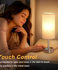 Person using Touch Table Lamp With USB-C And USB-A Ports, 3-Way Dimmable Bedside Desk Light in bedroom