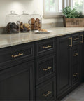 Champagne Bronze Cabinet Pulls 10-Pack, 5-1/16 Inch Hole Center on black cabinet drawers in modern kitchen