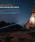 Person using PD36R V2.0 1700 Lumen Rechargeable Flashlight With USB C Fast Charge Real Talk Tactical Duty Light in rocky landscape