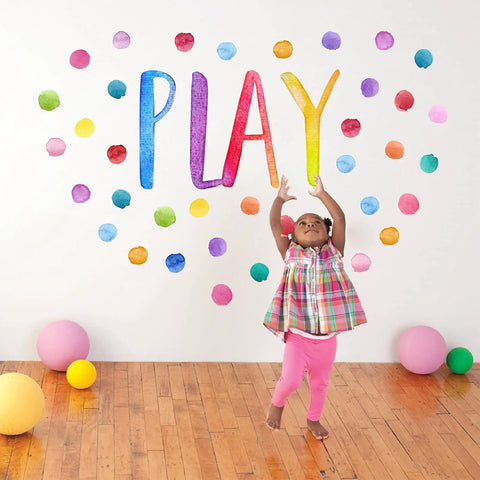 Child in colorful room with Kid Friendly Playroom Polka Dots Wall Decals Peel And Stick Watercolor Signs For Nursery Preschool Decor