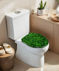 Elongated green moss old concrete wall green moss nature dark Toilet Seat on white toilet with natural decor.