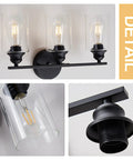 Detail of Black 3 Light Vanity Light Fixture Set With Clear Glass Shades Modern Farmhouse Bathroom Lighting Over Mirror