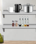 Two Pack Top Tier Wall Mounted Floating Shelves Crafted From Brushed Stainless Steel For Badass Kitchen Bar Restaurant And Hotel Setup With Rock Solid Brackets That Lock Firm And Handle Heavy Loads Daily, displayed with kitchen items.