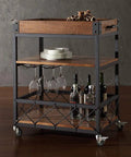 Three Tier Solid Pine and Steel Kitchen Cart with Built In Bottle Rack Industrial Vintage Rolling Utility Shelf Heavy Duty No Nonsense Roomside Storage Organizer, showcasing plates, glasses, and bottles.