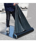 Person unrolling Heavy Duty Self Adhesive Flashing Tape Waterproof Roof Patch With Aluminum Foil Backing for leak repair.