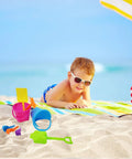 Child playing with Six Pack Mini Beach Bucket Sets With Sand Buckets Shovels Rakes And Scoops Ideal Party Favors For Kids on the beach