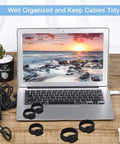 34 Piece Cord Management Organizer Kit with reusable cable ties and self-adhesive clips on desk next to laptop