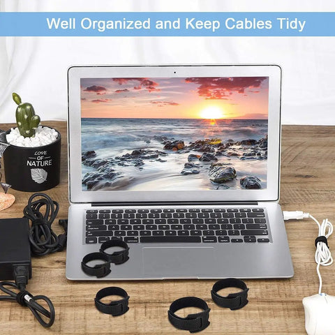 34 Piece Cord Management Organizer Kit with reusable cable ties and self-adhesive clips on desk next to laptop