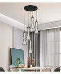 Modern Black Creative Pendant Lamp Pretty Waist LED Light for Duplex Living Room Staircase Loft Restaurant (Colour: 1Light Size: Neutrallight4000K) (5lights Neutrallight4000K) hanging above a dining table in a bright room.