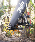 Close-up of a front hydraulic disc brake on a flat mount road gravel bike showcasing the caliper set installation detail.