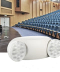 Six Pack White LED Emergency Lights With Battery Backup, Two Head Adjustable Emergency Lighting Fixtures in a theater setting