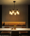 Six Light Matte Black Modern Farmhouse Chandelier With Clear Glass Shades Adjustable Hanging Industrial Pendant Lighting over dining table