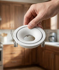OUNONA Recessed Lighting Trims: Spotlight Downlight Holder, MR16/GU10 Retrofit in white held by hand in a kitchen.