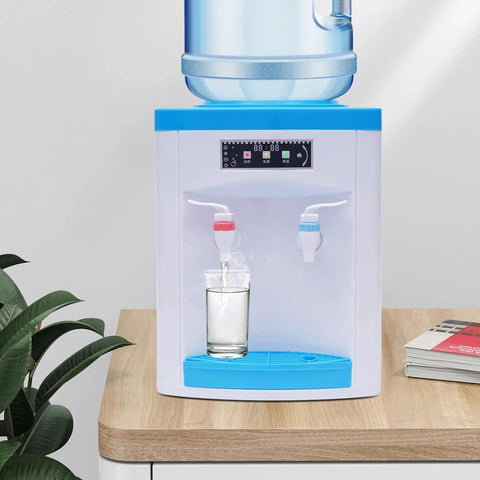 Hot And Cold Water Dispenser With Desktop 4.9 Gallon Tank Electric Cooler And Heater on wooden countertop, glass beneath spout