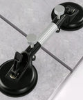 LOZLIN 2-piece countertop alignment clamps with adjustable vacuum suction, installed on a granite countertop.