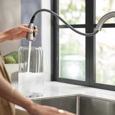Top Shelf Stainless Steel Pull Down Kitchen Faucet Featuring One Handle High Arc Design with smooth spray hose filling a glass jar.