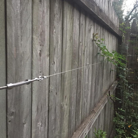 Stainless Steel Wire Rope Cable 1 16th Inch 500 Feet Vinyl Coated Braided 7x7 Core For Outdoor Use on wooden fence