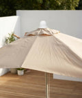 Get Your Patio Umbrella Looking Like New With These Durable White Plastic Top Cap Replacement Kits Perfect For Wind Weather Resistance And Easy Outdoor Sun Shade Maintenance Upgrades For Fishing Or Garden Vibes white umbrella top cap on beige patio umbrella