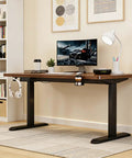 Electric Height Adjustable Standing Desk With Memory Controller And Anti Collision Guard Zero Hassle Adjustment Badass Durable Gaming Table For Home Office Ergonomic Setup 27 By 55 Inches in home office setup with monitor and accessories.