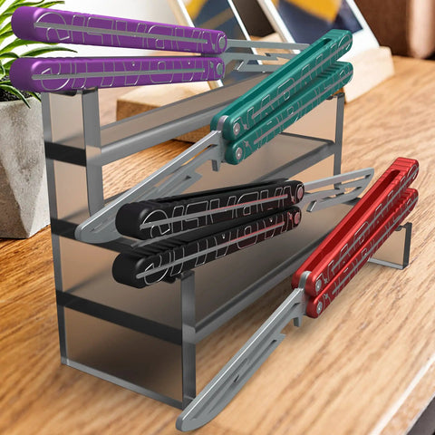 Assorted Lightning Washer System Butterfly Balisong Trainer With 6061 Aluminum Integral Channel Handle And Zen Pins on stand