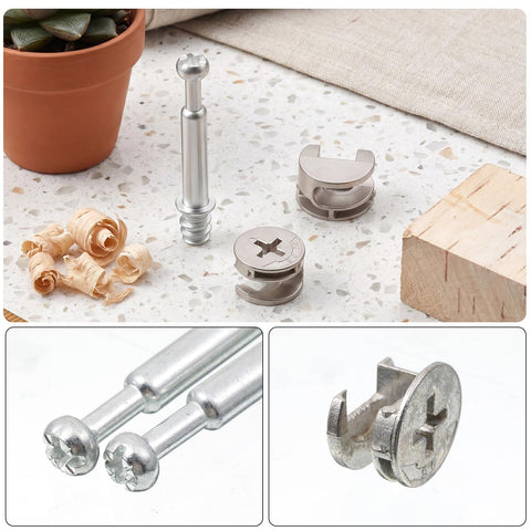Close-up of 25 sets furniture cam lock fasteners and connecting dowels 50 pieces in clear storage box with wood shavings