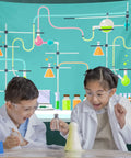 Kids in lab coats enjoying experiments in front of a 7x5ft Science Birthday Backdrop For Mad Scientist Party Decor Kid Friendly Chemistry Lab Theme Photo Booth Prop Polyester Seamless Non Reflective Photography Background Banner For School Classroom.