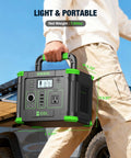 Person holding Portable On The Go Solar Generator Power Station With 288.6Wh Capacity, green color, outdoors for camping.