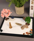 Mini Zen Garden Kit With White Sand, 10 By 7 Inch Rectangular Tray And Meditation Accessories setup with plants and stones