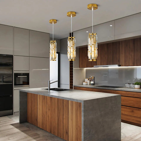 Gold Pendant Lights Set of 2 Dope Crystal Mini Chandelier for Kitchen Island, shown above modern kitchen island with sleek gold fixtures