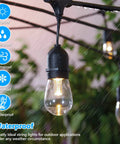 Triple Color Dimmable LED Outdoor String Lights For Patio with Remotes 48 Ft Waterproof lights in rain with lit bulb close-up.