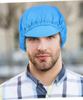 Man wearing a Five Pack Blue Anti Static Cleanroom Working Hat Built With Breathable Mesh And Heavy Duty Polyester.