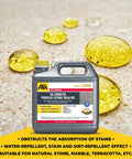 Real Deal Solvent Based Stone And Concrete Sealer For Granite Marble Limestone Indoors Outdoors One Gallon on surface reflecting yellow droplets.