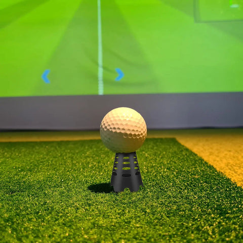 Golf ball on black plastic tee with simulator in background, part of Indoor Golf Spot Light For Simulators And Practice kit