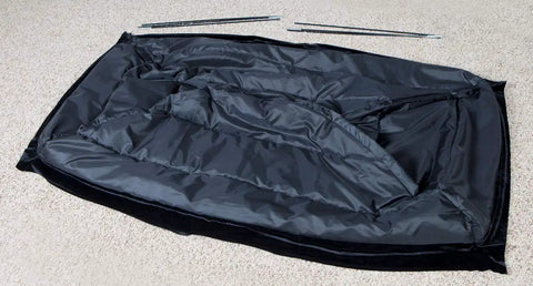 Stairway Attic Draft Cover for openings up to 25.5 by 54 inches in black fabric on carpet with installation rods visible