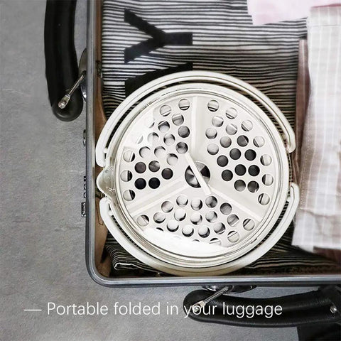 Foldable Electric Travel Hot Pot For Camping And Office stored in luggage, showcasing compact and lightweight design