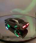 Mini RC Drift Car 1 To 64 Scale With LED Lights 4WD Pro Controls on reflective surface, showing illuminated rear and side LEDs.