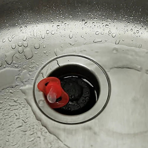 Disposal Genie Garbage Disposal Strainer And Splash Guard with Silicone Food Scraper in kitchen sink, water flowing