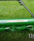 Manual 20-Inch 5-Blade Push Reel Lawn Mower With Ball Bearing Reel, Dual Tracking Wheels, easy push, green finish in use on grass