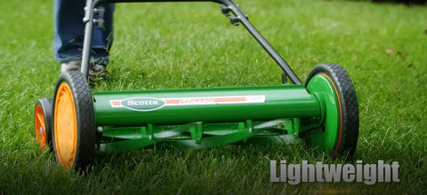 Manual 20-Inch 5-Blade Push Reel Lawn Mower With Ball Bearing Reel, Dual Tracking Wheels, easy push, green finish in use on grass