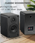 Classic wooden finish on powered bookshelf speakers with wireless 100W RMS Bluetooth and eARC, carbon fiber 4-inch woofers.