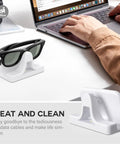 Slick Charging Stand With USB-C Cable For Ray-Ban Meta Smart Glasses Gen 1 And Gen 2 next to laptop on desk
