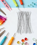 Beading Needle Set For Bead Stringing 200 Pcs Jewelry Threading Needles With Bend Resistant Metal Design Ideal For Necklaces And Bracelets Easy To Use For Beginners To Pro Crafters Great For Family Craft Nights. silver metal bead threading needles on craft table