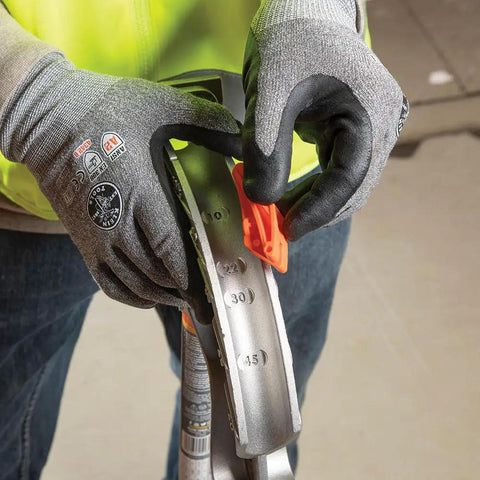 Person adjusting aluminum conduit bender full assembly for 1/2-inch EMT with wide foot pedal and angle setter