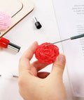 Using Twenty Piece Circle Clay Cutter Set With Stainless Steel Ring Molds to sculpt a flower in red clay