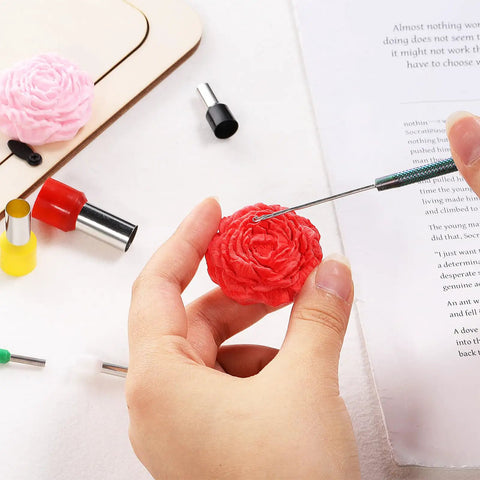 Using Twenty Piece Circle Clay Cutter Set With Stainless Steel Ring Molds to sculpt a flower in red clay