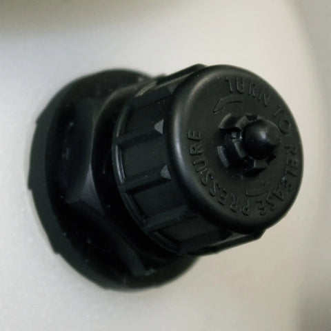 Close-up of 3 Gallon Premier Pro XP Poly Tank Sprayer pressure relief system valve on a white tank surface.