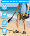 Person holding stainless steel metal detecting shovel kit with foldable beach sand scoop for treasure hunting on the beach.