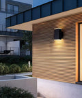 Ultra Sleek 9 Inch LED Rectangle Outdoor Wall Light In Aluminum, Matte Black Finish, up down lighting on exterior wall.