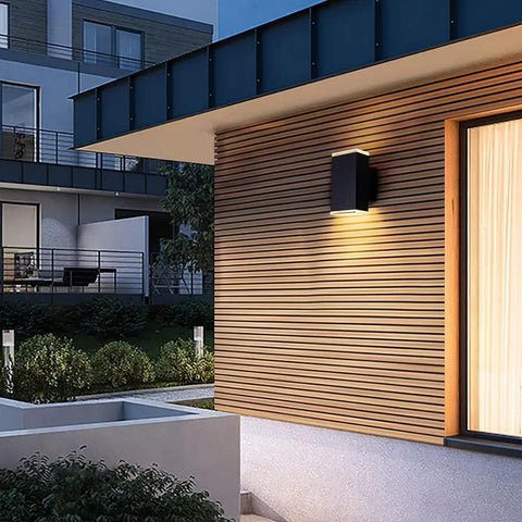 Ultra Sleek 9 Inch LED Rectangle Outdoor Wall Light In Aluminum, Matte Black Finish, up down lighting on exterior wall.