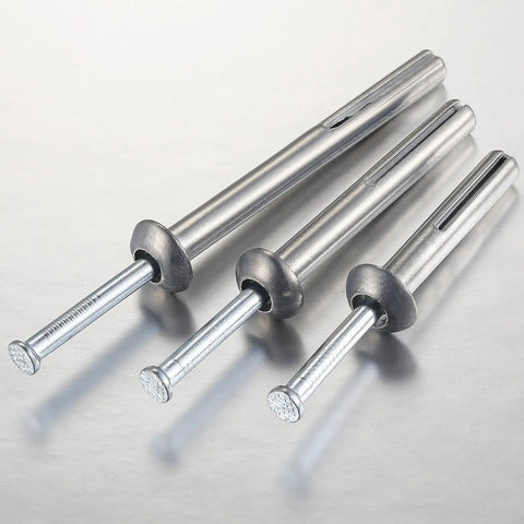 Close-up of zinc alloy anchors, part of One Quarter Inch By Three Inch Hammer Drive Nail In Anchor Set For Concrete Cement And Brick Walls 50 Pack